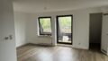 Wohnzimmer mit kleinem Balkon
